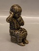 Royal 
Copenhagen 
Stoneware 5395 
Boy sitting 15 
cm Signed JH 
for Johannes 
Hedegaard. In 
nice and ...