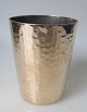Hammered 
drinking cup in 
brass, 19th 
century. 
Denmark. I. 
Brandt. 
Conical. 
Height: 9 cm.