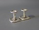 A pair of low 
candlesticks in 
830 silver no.: 
432 stamped M. 
G. & S. 
H - 6,5 cm, W 
- 6,5 cm ...