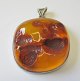 Large polished 
amber pendant 
with silver 
fitting, 20th 
century. 
Denmark. 5.5 x 
5.5 cm. ...