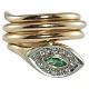Gold jewelley. 
A ring of 14k 
gold set with 
an emerald and 
numerous 
diamonds. 
Ring in shape 
...