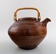 Gutte Eriksen 
own workshop, 
tea pot in 
ceramics. 
Handle in 
wicker.
Stamped: 
Gutte.
Denmark mid 
...
