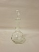 Decanter/carafe, 
glass with 
stopper
About 1920
With olive 
cuttings
H: 22cm incl. 
stopper
We ...
