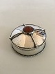 Christian 
Fjerdingstad 
Pill Box in 826 
Silver 
ornamented with 
an Amber Stone. 
Measures 2.2 cm 
H ...