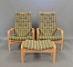 This set of a 
pair of 
armchairs and a 
footstool is a 
beautiful 
example of 
mid-20th 
century ...