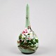 Japanese 
porcelain vase. 
app. 1900. 
Light green 
overglaze with 
hand paintings 
of flowers. 
With ...
