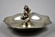 Backhaus bowl 
in hammered 
pewter with 
seated naked 
woman, 20th 
century. 
Denmark. 
Stamped: ...