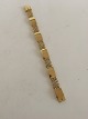 Georg Jensen 
18K Gold 
Bracelet No. 
314B designed 
by Harald 
Nielsen. 18.5 
cm L. 1.2 cm 
wide. ...