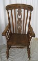 Windsor 
armchair, 
England, 19th 
century. In 
polished elm 
with curved 
bar-back and 
with decorated 
...