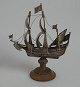 Ship in silver, 
treemaster with 
sail. 20th 
century 
Amsterdam, The 
Netherlands. On 
wooden block. 
...