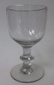 Wine glass on 
stalk, approx. 
1850. 
Conradsminde. 
Denmark. Light 
gray glass 
mass. Height: 
11 ...