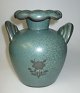 Arabia vase, 
280, 20th 
century. 
Finland. Green 
glaze. 
Decorated with 
flowers. 
Stamped. 
Height: ...
