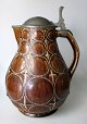 German jug, 
stoneware, 19th 
century. Brown 
glazed. With a 
lid of pewter. 
Stamped.: 
Reinholt. ...