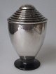 Silver sugar 
caster can, 
1936, Denmark. 
Funkis shape 
with backlite 
foot. Height: 
10 cm. 81 ...