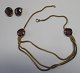 Jewelery set 
consisting of 
necklace and 
ear clip, 20th 
century. Gold 
plated with 
spinels. Length 
...