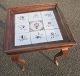 Tiled table, 
20th century 
with 9 antique 
tiles. Pine / 
beech. Capriole 
leg and high 
edge. With 9 
...
