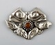 Danish Art 
Nouveau brooch 
in silver. 
Early 1900s.
Stamped.
Measures: 65 
mm.
In very good 
...