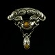 Danish Art 
Nouveau Silver 
Brooch with 
Amber - Knud 
Georg Jensen.
Designed and 
crafted by Knud 
...