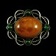 Otto Strange 
Friis. Art 
Nouveau Silver 
Brooch with 
Amber and 
Malachite. 
Designed and 
crafted ...