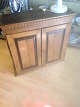 Louis seize / 
Empire
Oak-wood 
Hanging 
cupboard with 
tooth cut
Height: 74 cm. 
Width: 77 cm. 
...