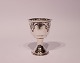 Egg cup in Art 
Noveau style 
from the 1930s 
and of 
hallmarked 
silver.
7x4,5 cm.
