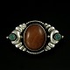 William Fuglede 
1907 - 1937. 
Art Nouveau 
Silver Brooch 
with Amber and 
Green Agate.
Designed and 
...