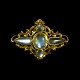 Art Nouveau 14k 
Gold Brooch 
with 
Moonstones.
3,5 x 4,8 cm. 
/ 1,34 x 1,89 
inches.
Weight 9,4 ...