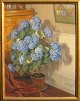 Lønborg, Harald 
(1868 - 1942) 
Denmark. A 
flowering 
potted plant in 
a sunlit living 
room. Oil on 
...