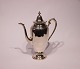 Coffee jug 
decorated with 
ivory and of 
925 sterling 
silver, stamped 
#461 Gorham.
25x20x7 cm.
