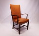 This armchair, 
upholstered in 
cognac colored 
elegance 
leather with 
brass buttons 
and a frame of 
...