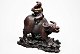 Chinese wood 
cut with 
flute-playing 
boy on a bull. 
20th C. 
Boxwood. On 
wooden foot. 
With ...