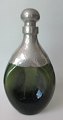 Green carafe 
with pewter 
fitting and 
stopper, art 
deco, 1920s. 
Denmark. 
Stamped: 
Gerolin. ...