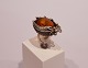 Ring with large 
piece of amber 
decorated with 
feather of 925 
sterling silver 
and stamped ...