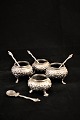 4 small 1800 
Century , 
Russian salt 
and pepper 
baskets on 
silver feet 
with each their 
small ...