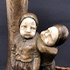 Height 31 cm.
The lamp is in 
good condition 
with some age 
related patina 
to the children 
...