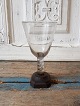 Norwegian 
1700th glass on 
wooden stand.
Featuring an 
error on the 
edge of the 
glass, see ...