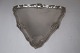 A. Dragsted. 
Silver (830). 
Triangular 
silver tray. 
Length 30 cm. 
Produced 1908.