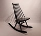 The 
Mademoiselle 
rocking chair, 
designed by 
Ilmari 
Tapiovaara in 
1956 for Artek, 
is an iconic 
...