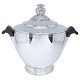 K. C. Hermann 
silver. 
K. C. Hermann; 
A champagne 
cooler with lid 
in hallmarked 
silver. 
H. 33 ...