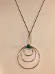 silver pendant 
with green jade
Diameter: 5 
cm. Height with 
ax: 9 cm.
chain length: 
45 ...
