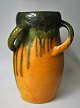 Danish floor 
vase, approx. 
1920. Pottery. 
Decorated with 
green and 
yellow glaze. 
With 3 handles. 
...