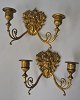 A pair of 
French gilded 
wall hangers, 
19th century. 
Each with two 
light arms. 
Decorated with 
...