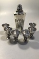 Evald Nielsen 
Sterling Silver 
Cocktailshaker 
and six  
drinking cups 
Shaker H 23 
cm/9.05" Weight 
...