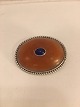 
Brooch with 
amber and blue 
sapphire and 
silver bead 
table at the 
edge.
Silver 830 s 
GPB (G.P. ...