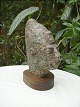 Head carved in 
stone
H: 25 cm