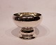Bowl on foot of 
hallmarked 
silver and 
simply 
decorated. The 
bowl is in 
great vintage 
...