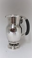 Georg Jensen. 
Sterling (925). 
Silver jug with 
grapes. Design 
407A. Height 23 
cm
