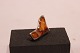 Brooch of 925 
sterling silver 
and amber.
3,5x2 cm.