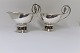 Georg Jensen. 
Sterling (925). 
A pair of sauce 
bowls with 
grapes. Design 
296A. Length 24 
cm. ...