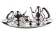 Georg Jensen 
Sterling Silver 
Henning Koppel 
Tea and Coffee 
Set with Tray 
No 1017. The 
set is ...
